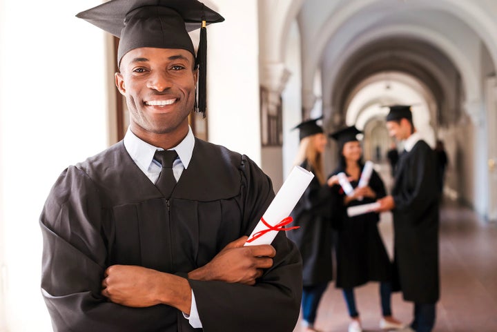 college graduate holding his diploma | Jenkins Subaru in Bridgeport WV