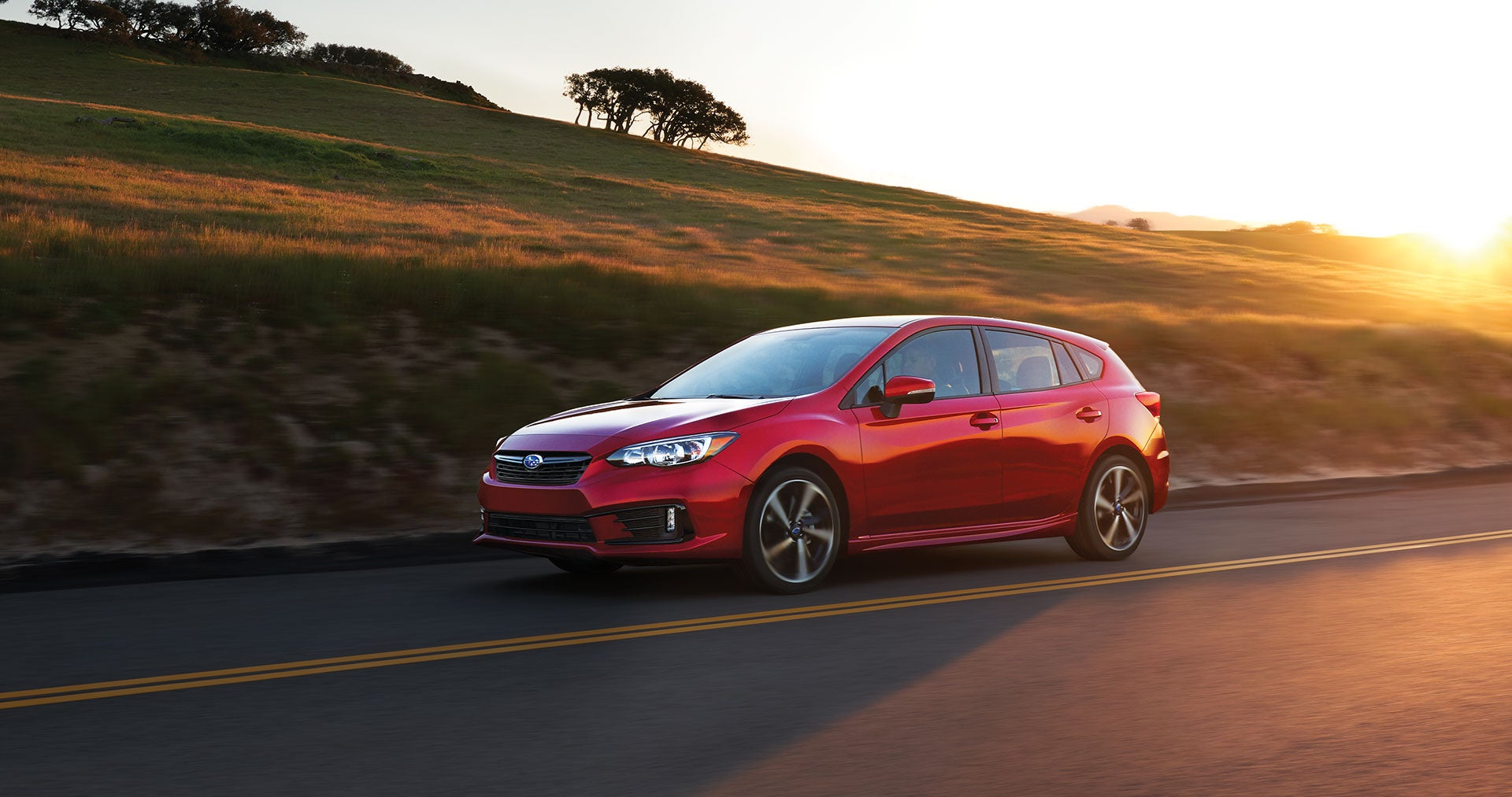 Subaru impreza driving on road