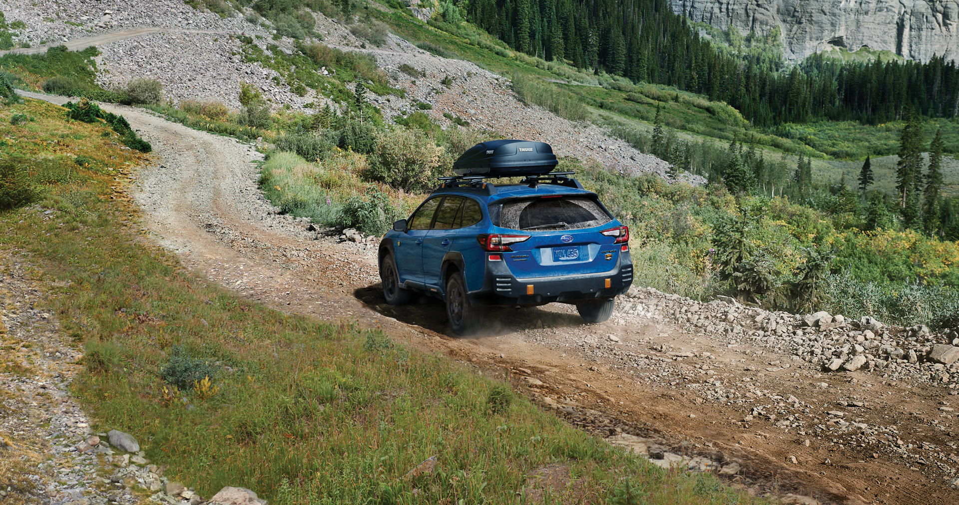 Subaru outback_wilderness driving on rocky path